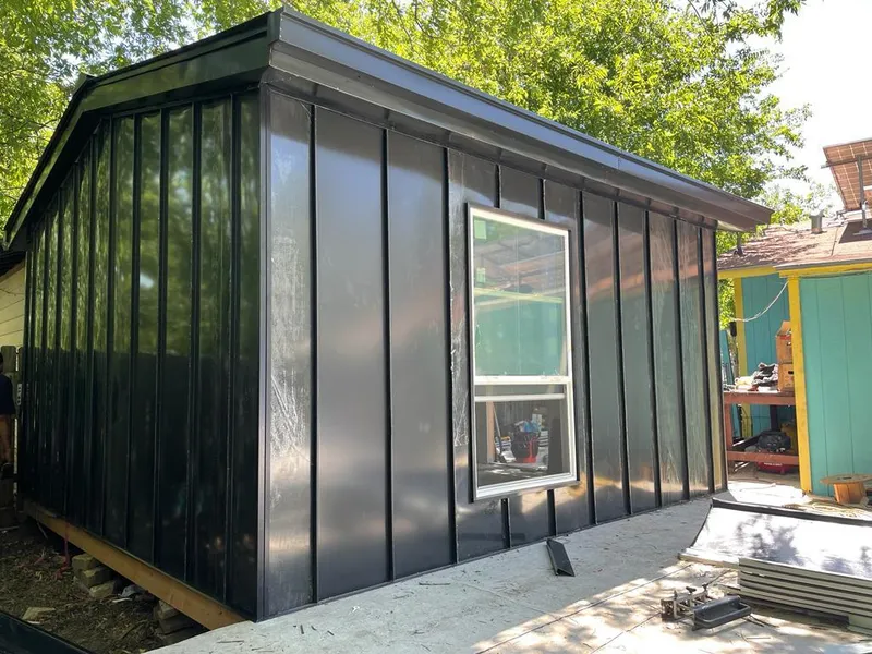 Black standing seam metal wall panels for Roof Inspection in Socorro